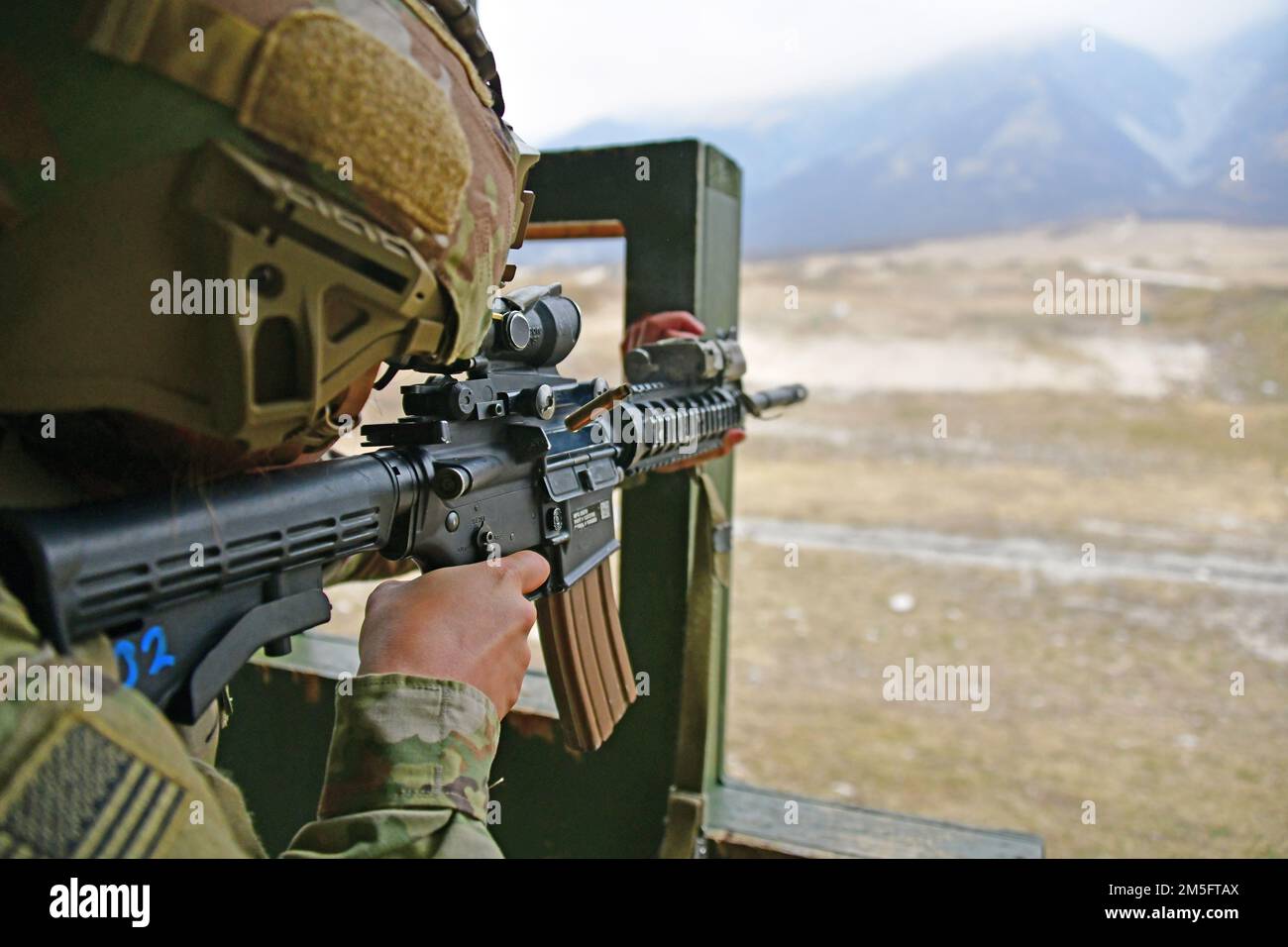 U.S. Army Pfc. Meggan A. Muzquiz, Paratrooper assigned to the 2nd Battalion, 503rd Infantry Regiment, 173rd Airborne Brigade, engages a pop-up targets with  an M4 carbine during marksmanship training at Cao Malnisio Range, Pordenone, Italy, March 15, 2022. The 173rd Airborne Brigade is the U.S. Army’s Contingency Response Force in Europe, providing rapidly deployable forces to United States European, African, and Central Command areas of responsibility. Stock Photo