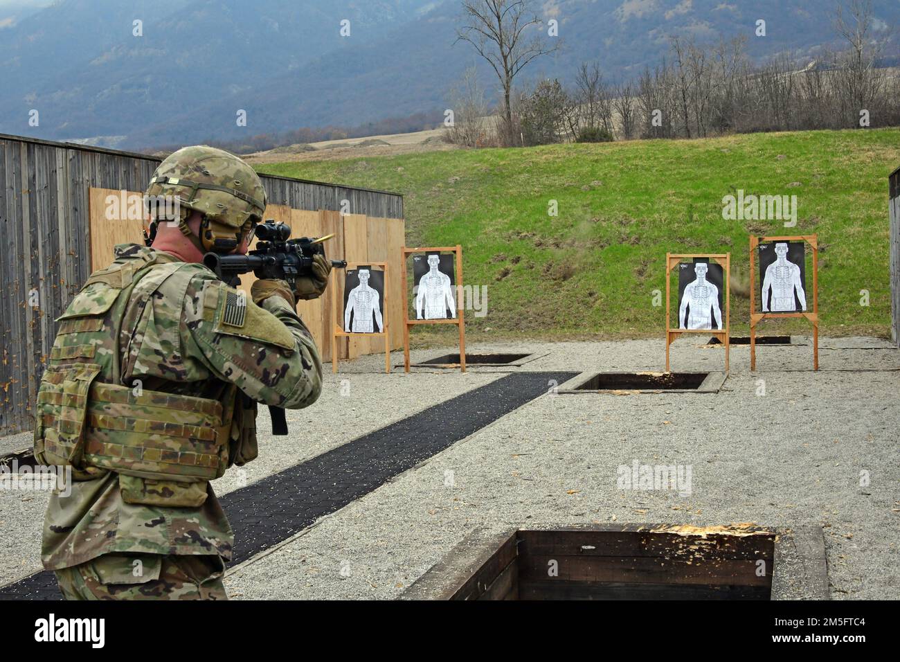 A U.S. Army Paratrooper, assigned to the 1st Battalion, 503rd Infantry Regiment, 173rd Airborne Brigade, engages targets with an M4 carbine during marksmanship training at Cao Malnisio Range, Pordenone, Italy, March 15, 2022. The 173rd Airborne Brigade is the U.S. Army’s Contingency Response Force in Europe, providing rapidly deployable forces to United States European, African, and Central Command areas of responsibility. Stock Photo