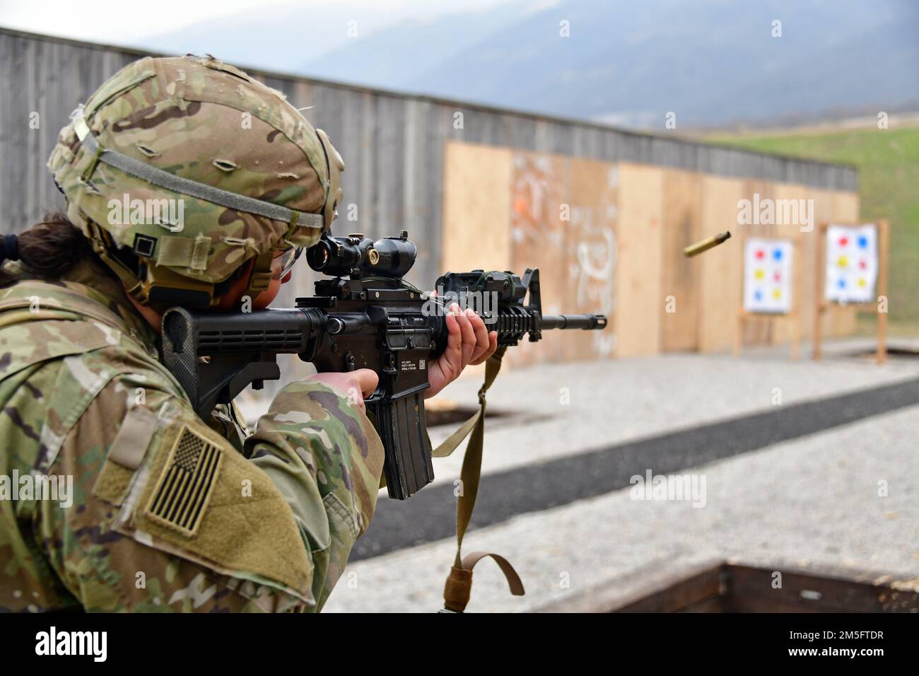 A U.S. Army Paratrooper, assigned to the 1st Battalion, 503rd Infantry Regiment, 173rd Airborne Brigade, engages targets with  an M4 carbine during marksmanship training at Cao Malnisio Range, Pordenone, Italy, March 15, 2022. The 173rd Airborne Brigade is the U.S. Army’s Contingency Response Force in Europe, providing rapidly deployable forces to United States European, African, and Central Command areas of responsibility. Stock Photo