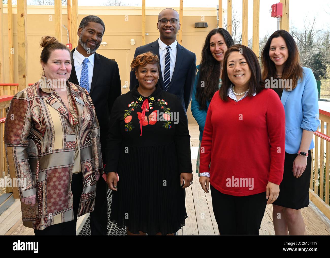 (Front) Teresa Quinn-Veseley, 11th Force Support Squadron; Shanee Johnson, Apple Tree at LEARN DC principal; Cherise Imai, executive director of the Military Interstate Children's Compact Commission; and (Back row) Horace Franklin, Naval District Washington school liaison; Alonso Hay, Joint Base Anacostia-Bolling school liaison; Andrea Groeninger, LEARN DC principal; and Commissioner Clara Botstein, director of legislation and government relations at the D.C. office of the deputy mayor for education, pose for a group photo on March 15, 2022 on the campus of the first charter school on JBAB, Wa Stock Photo