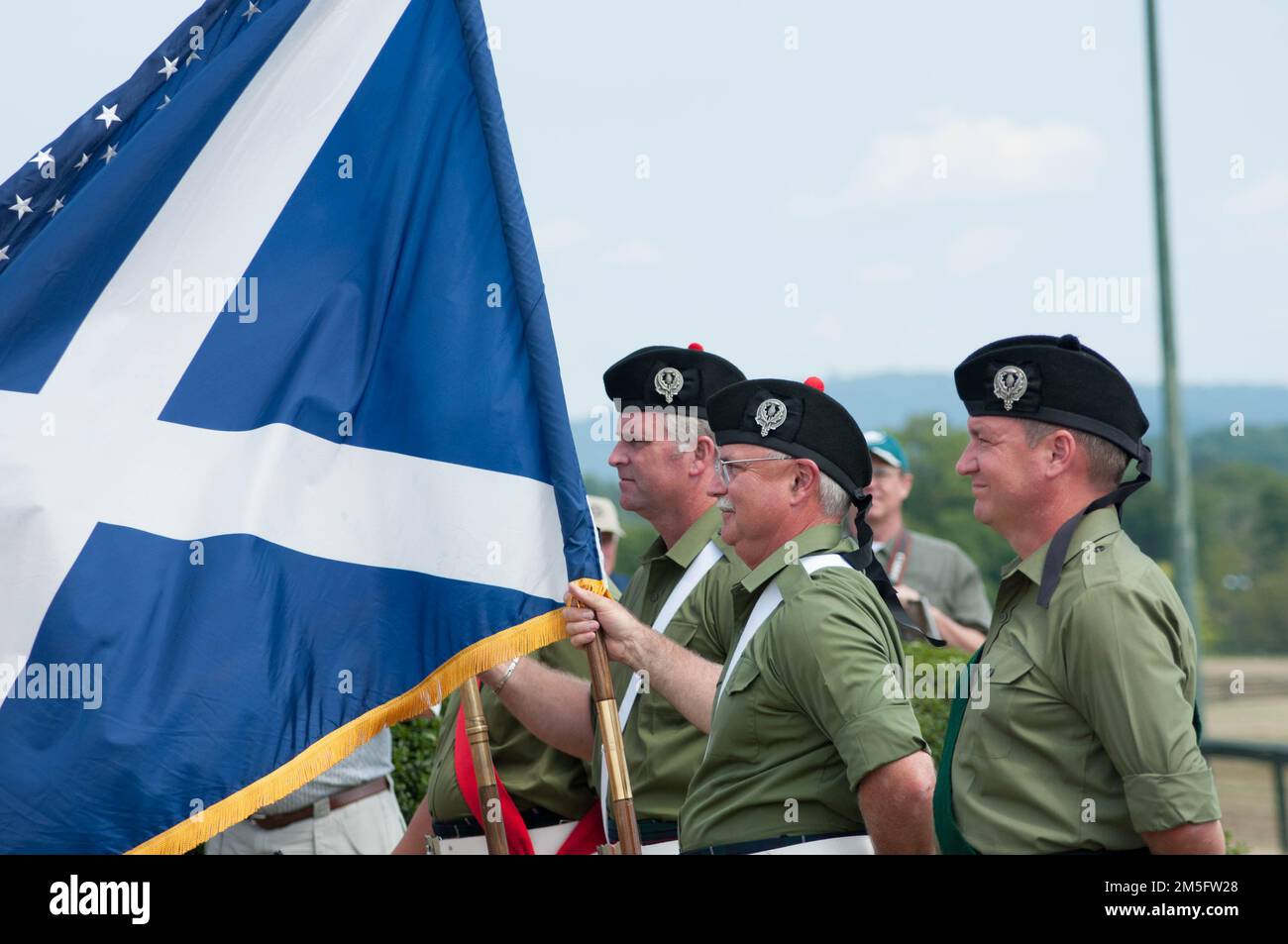 Scottish flag, St. Andrew's Cross, with color guard at a Scottish heritage festival in Virginia, USA. Stock Photo