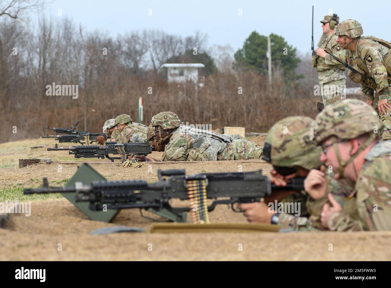 Soldiers assigned to Headquarters and Headquarters Battalion, 101st Airborne Division (Air Assault) qualify with the M240B on Fort Campbell, Ky March 16, 2022. Soldiers train to be familiarized with a variety of weapons systems in order to increase their overall lethality on the field of battle. Stock Photo