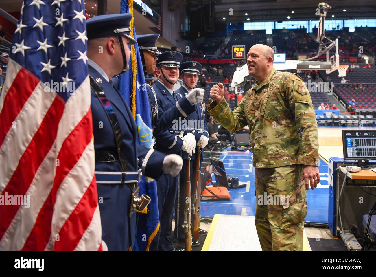 Col. Patrick Miller, 88th Air Base Wing commander, greets members of the Wright-Patterson Air Force Base Honor Guard before the start of the NCAA men’s basketball tournament March 15, 2022, at the University of Dayton Arena. The Honor Guard performed in the opening ceremony. Stock Photo