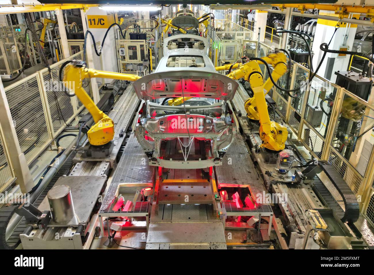 YANTAI, CHINA NOVEMBER 17, 2022 Industrial robots make cars on a
