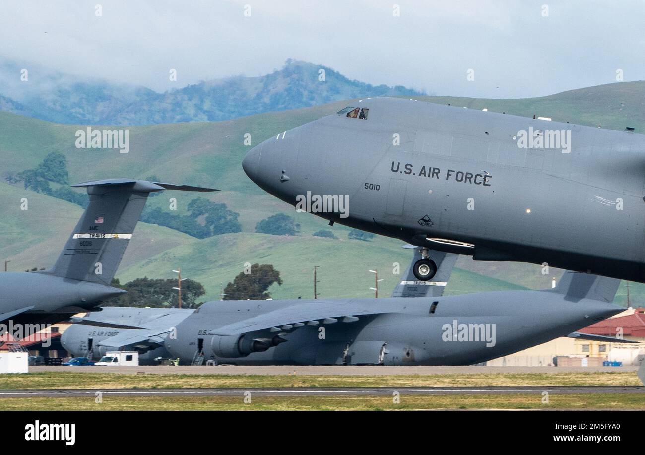 A U.S. Air Force C-5M Super Galaxy takes off from Travis Air Force Base, California, March 15, 2022. As the Air Force’s largest strategic airlifter, the C-5M can carry more cargo farther distances than any other aircraft. The C-5M Super Galaxy strategic transport aircraft, a modernized version of the legacy C-5, was designed and manufactured by Lockheed Martin to extend the capability of the C-5 Galaxy fleet to remain in service at least until 2040. Stock Photo