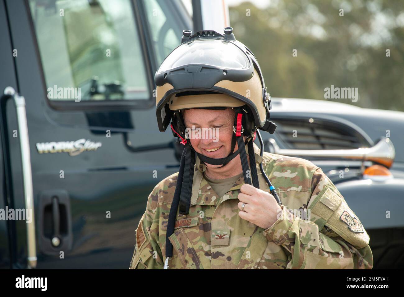 U.S. Air Force Col. Corey Simmons, 60th Air Mobility Wing commander, wears an Explosive Ordnance Disposal blast suit helmet during a visit to the EOD range at Travis Air Force Base, California, March 15, 2022. The helmet is designed to protect against the four main blast threats: overpressure, fragmentation, impact and heat. Trained to detect, disarm and dispose of explosive threats in extreme environments, EOD technicians serve as the Air Force’s bomb squad. Stock Photo