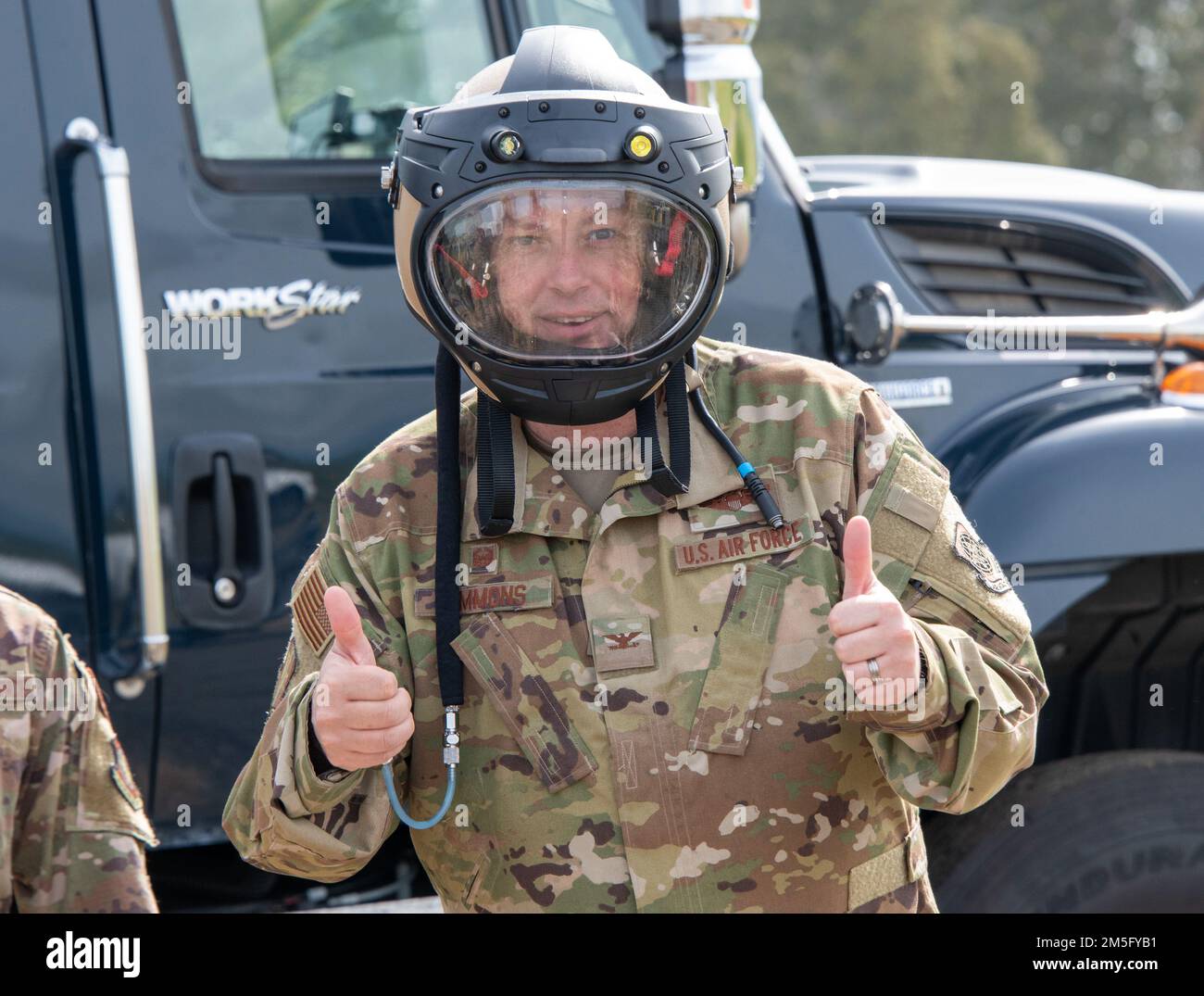 U.S. Air Force Col. Corey Simmons, 60th Air Mobility Wing commander, wears an Explosive Ordnance Disposal blast suit helmet during a visit to the EOD range at Travis Air Force Base, California, March 15, 2022. The helmet is designed to protect against the four main blast threats: overpressure, fragmentation, impact and heat. Trained to detect, disarm and dispose of explosive threats in extreme environments, EOD technicians serve as the Air Force’s bomb squad. Stock Photo
