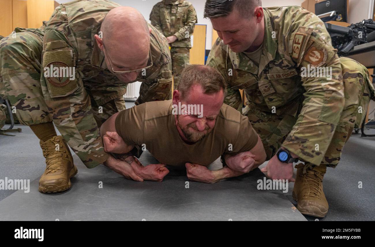 U.S. Air Force Airmen support a German air force airman from the NATO ...