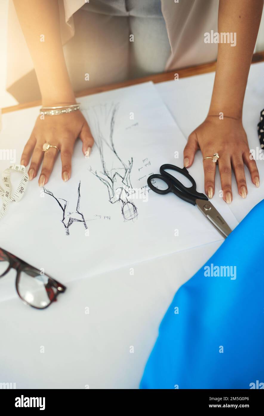 I draw fashion. a fashion designer working on a new design Stock Photo ...
