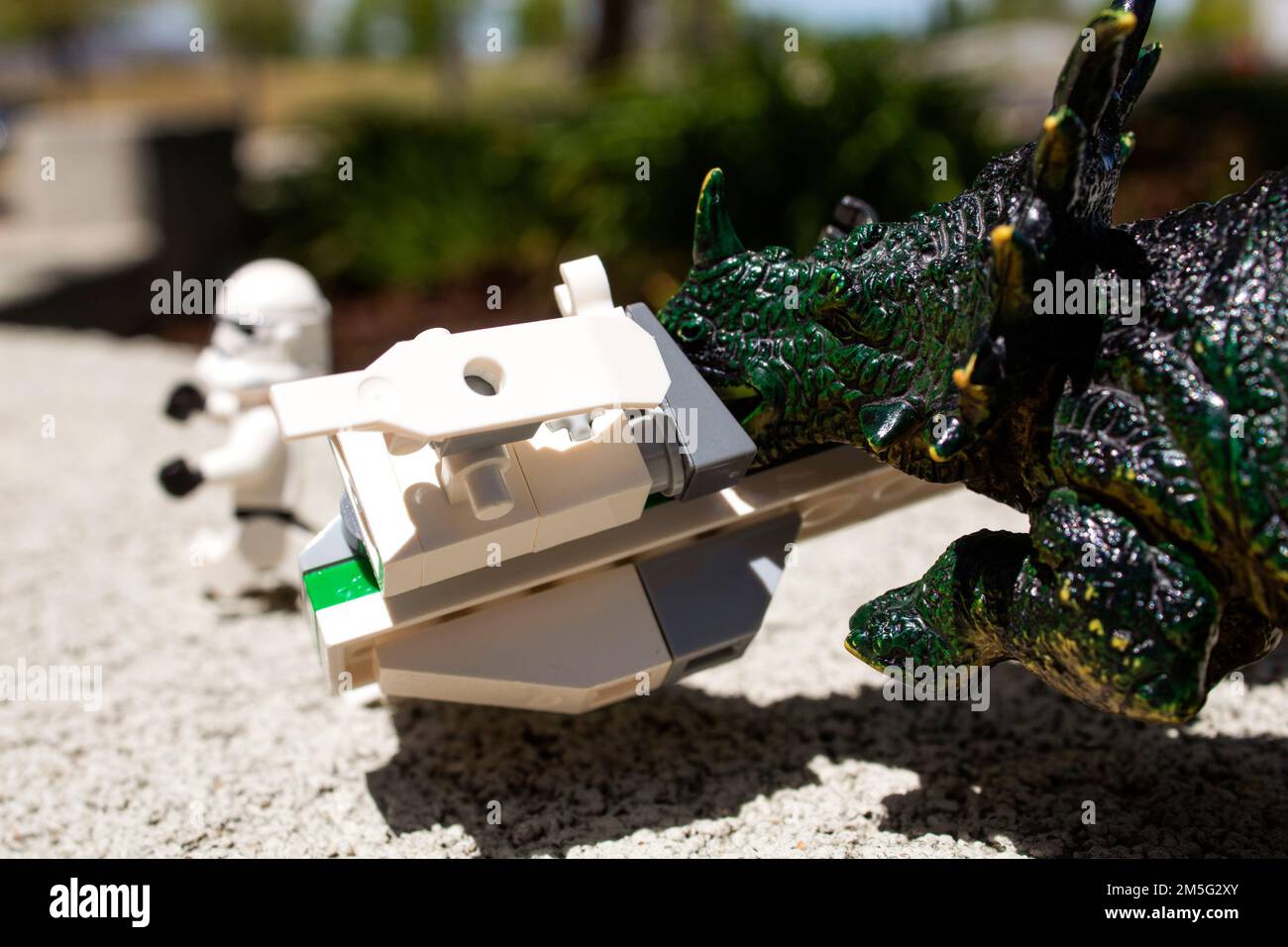 Toy Dinosaur Chasing Lego Star Wars Storm Trooper Stock Photo