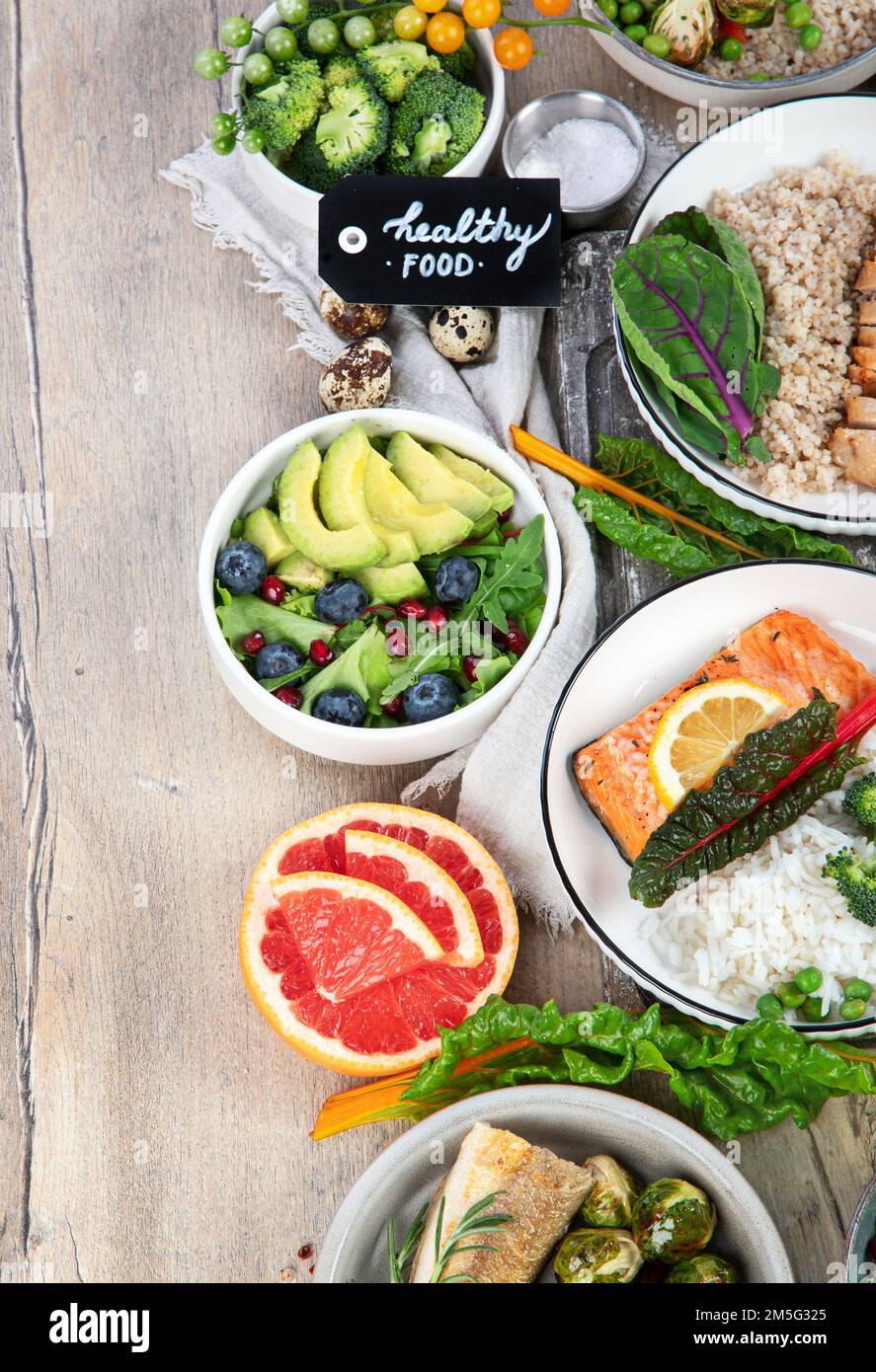 Table of various healthy food dishes. Healthy food assortment. Dieting ...