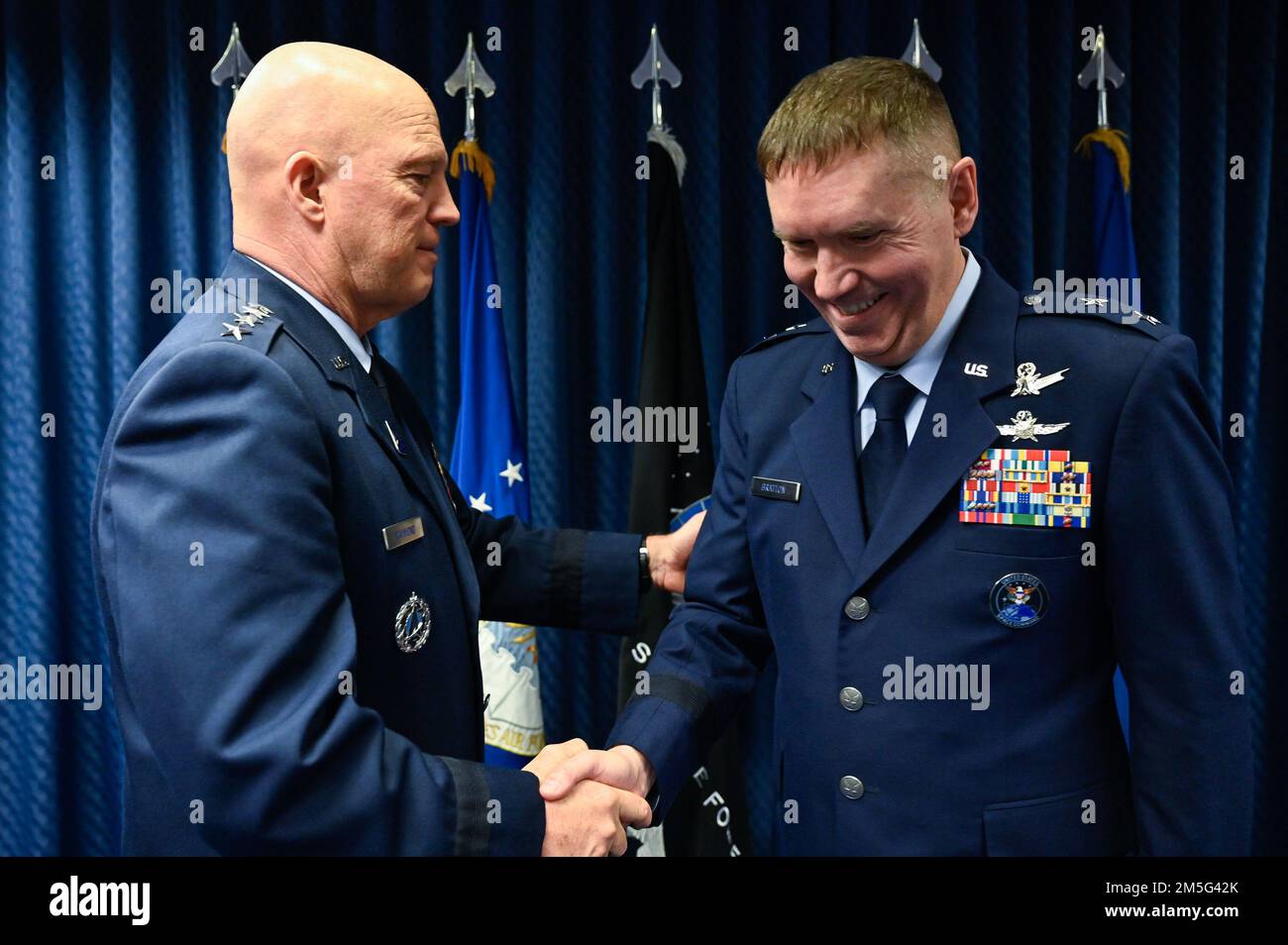 Chief of Space Operations Gen. John W. “Jay” Raymond congratulates Maj. Gen. Shawn Bratton during his promotion to major general at the Pentagon, Arlington, Va., March 16, 2022. Bratton is the commander of Space Training and Readiness Command. Stock Photo