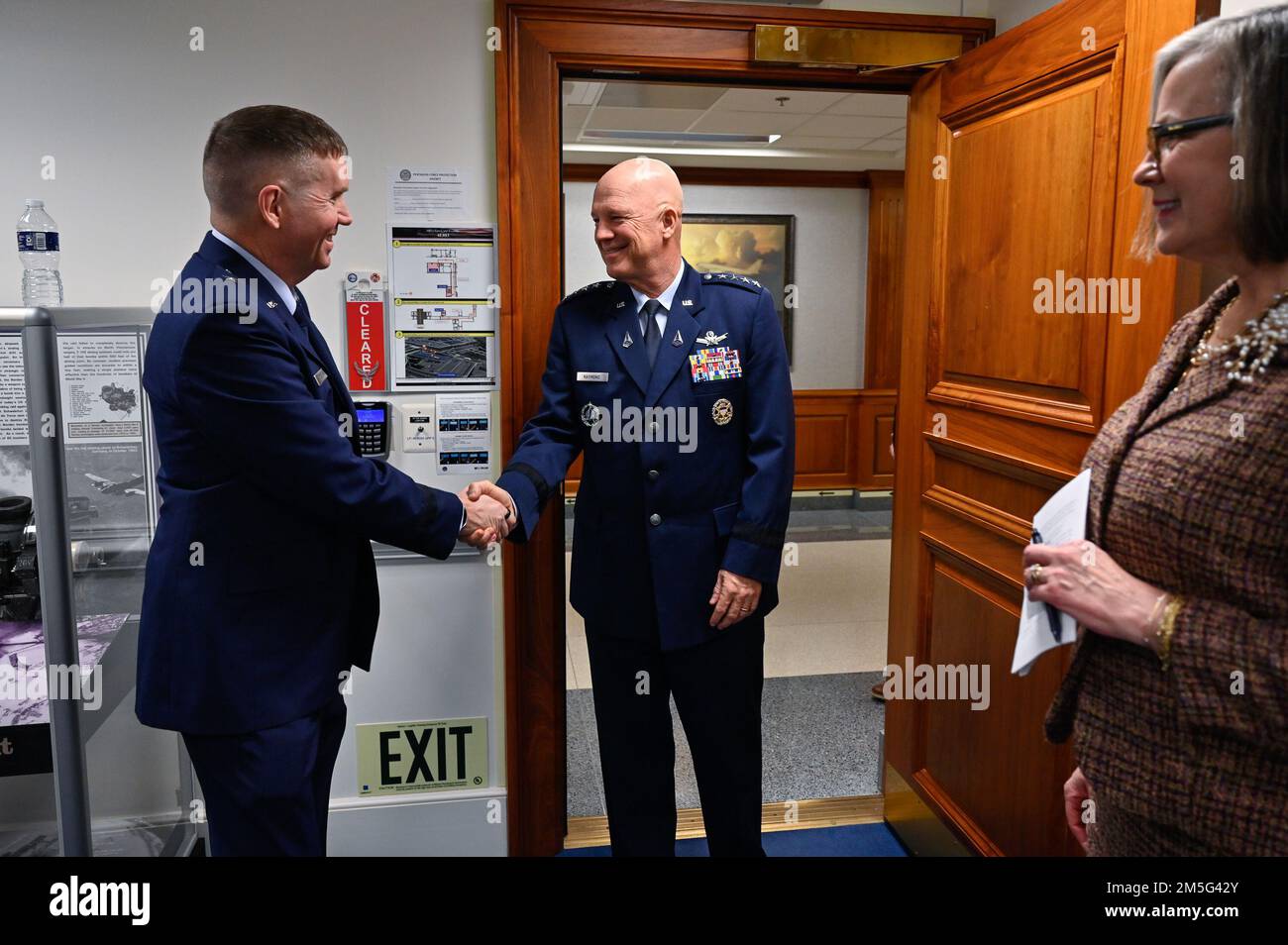 Chief of Space Operations Gen. John W. “Jay” Raymond, center, greets Brig. Gen. Shawn Bratton before promoting him to major general at the Pentagon, Arlington, Va., March 16, 2022. Bratton is the commander of Space Training and Readiness Command. Stock Photo