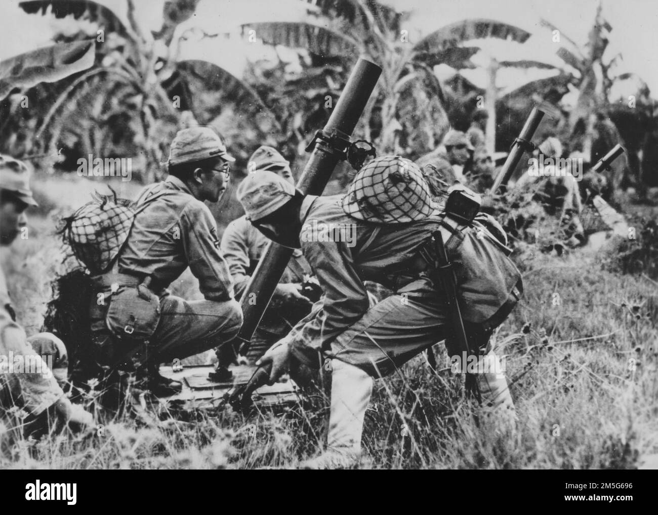 Pacific War, 1941-1945. An Imperial Japanese Navy mortar crew garrisoned on Saipan trains in anticipation of an attack on the island from Allied Forces, May 1944. Stock Photo