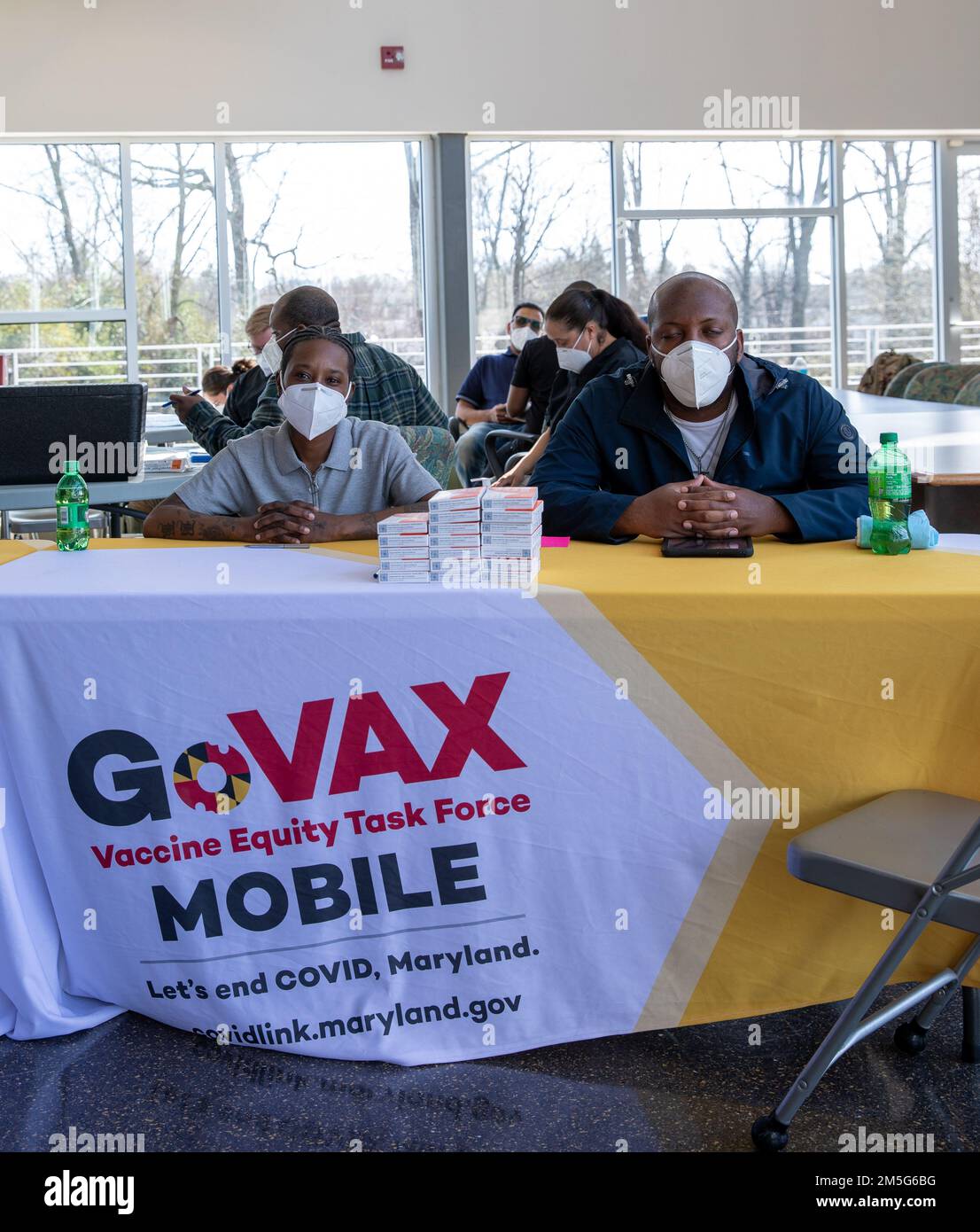 Staff Sgt. Harris Chanel (left), a chemical, biological, radiological, and nuclear specialist with the 175th Infantry Regiment, Maryland National Guard, and Spc. Minix Willis (right), a patient administration specialist with the Maryland Medical Detachment, Maryland National Guard, pose for a photo during a vaccination clinic at the Board of Child Care's Residential Child Care center, March 16, 2022, in Windsor Mill, Maryland. Soldiers provided inoculations for residents and staff during a clinic supported by the Vaccine Equity Task Force, an initiative to promote equitable access to the COVID Stock Photo