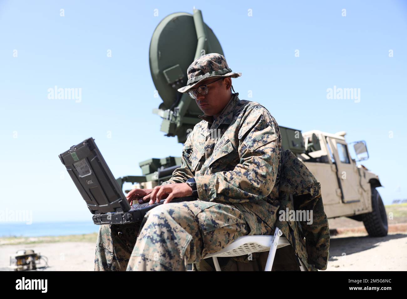 U.S. Marine Corps LCpl. Cesar Cruz, a satellite transmissions system ...