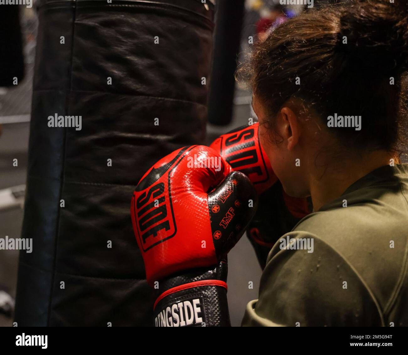 U.S. Marine Corps 1st Lt. Stephanie Simon, the team captain of II Marine Expeditionary Force Martial Arts Center of Excellence boxing team, practices her techniques on a punching bag, Camp Lejeune, N.C., March 16, 2022. Simon is the two-time National Champion in boxing and keeping her skills sharp is essential for her success. Stock Photo