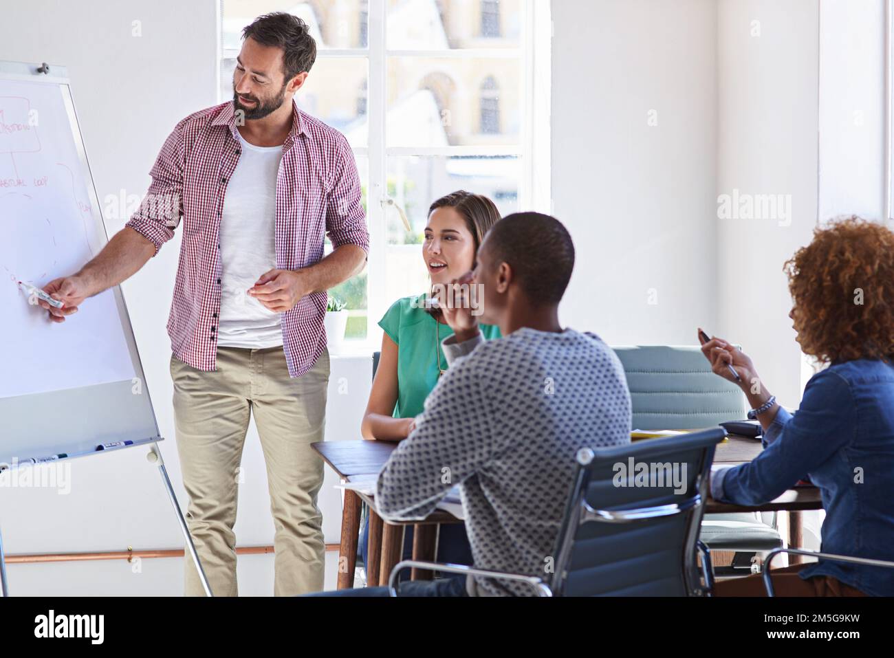 Delivering an expert presentation. a young businessman giving a