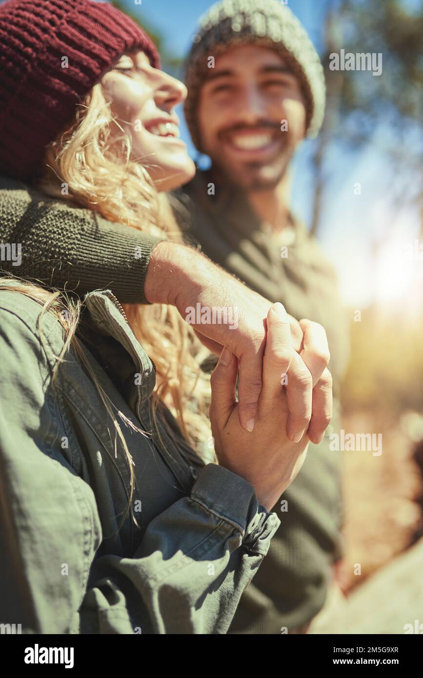 Should we head for the top. an affectionate young couple hiking. Stock Photo