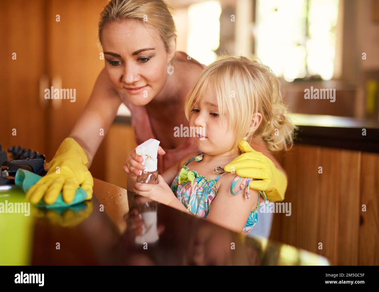 Cleaning up is everyones responsibility. a mother and daughter cleaning