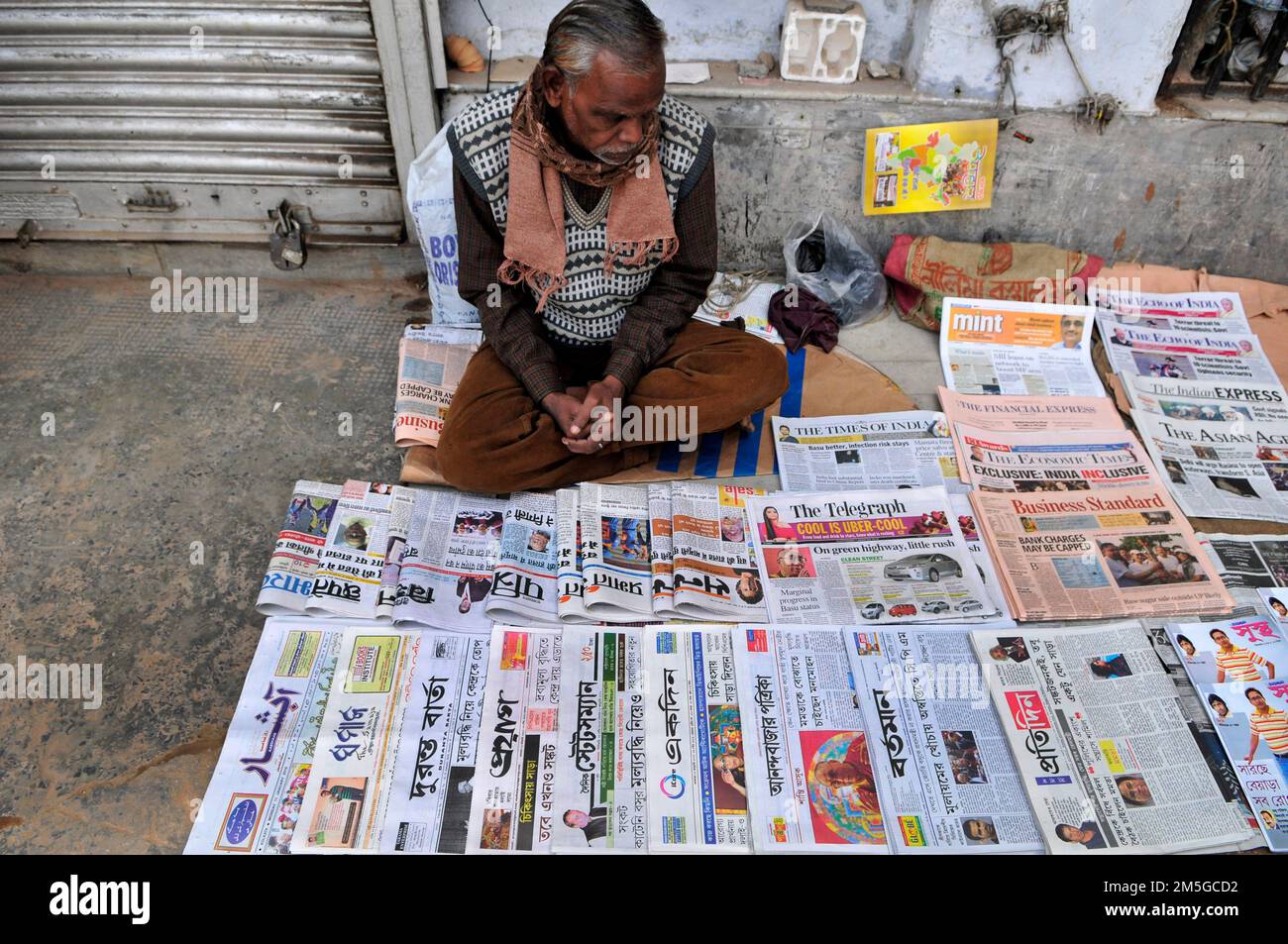 A Newspaper vendor in Esplanade, Kolkata, India. Stock Photo