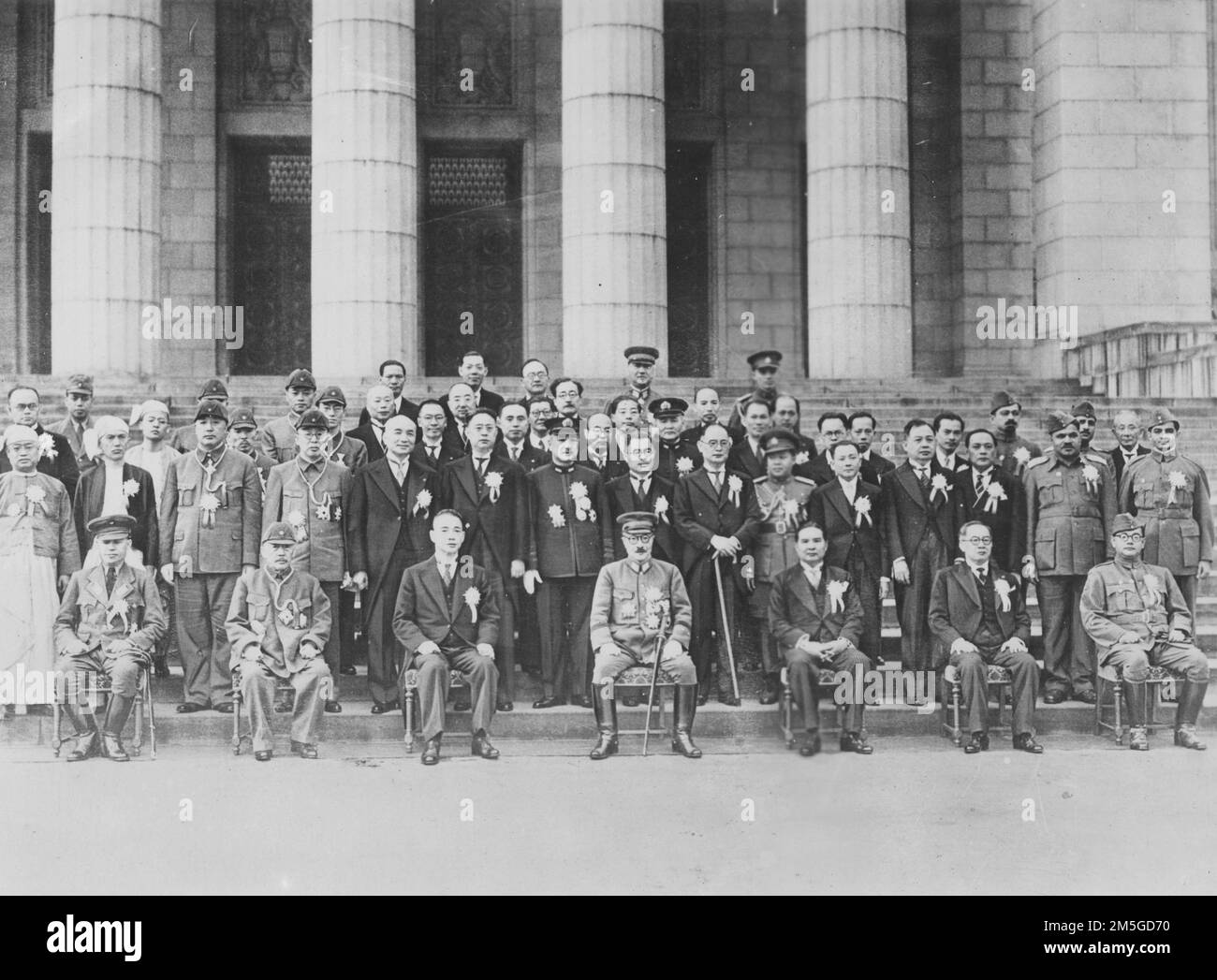 Pacific War 1941-1945. Japanese Prime Minister Hideki Tojo gathered with Japanese military staff, cabinet ministers, and pro-Japanese delegations from Burma, Manchuria, China, Thailand, the Philippines, and India in front of the National Diet Building in Tokyo during the Greater East Asia Conference, November 1943. Stock Photo