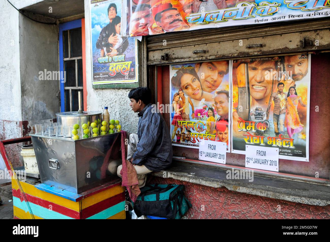 A lime water vendor standing outside a cinema in central Kolkata, India. Stock Photo