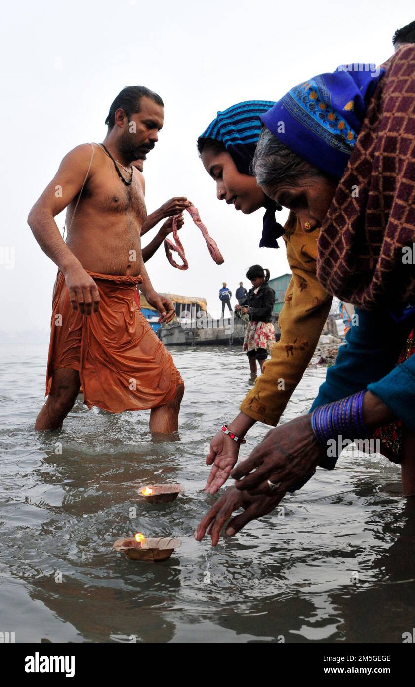 Early morning bathing and prayers at Babughat on the banks of the ...