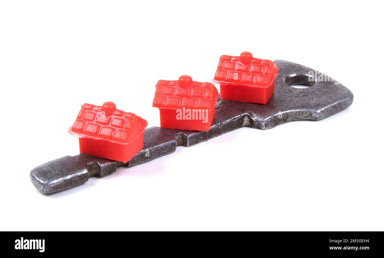 Toy houses on  a old key - Home Ownership Concept Stock Photo