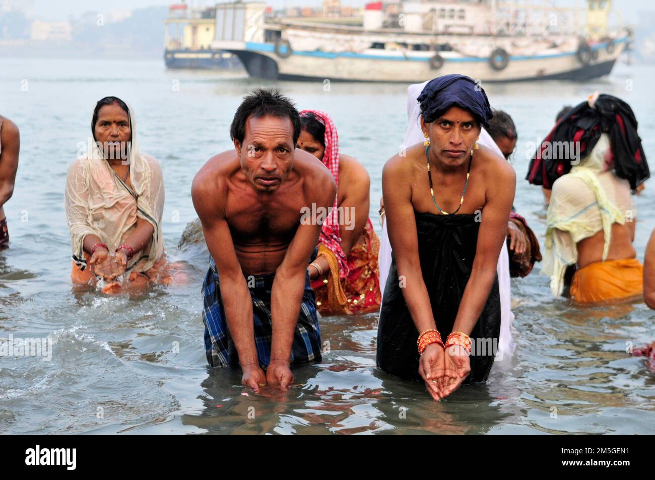 Early morning bathing and prayers at Babughat on the banks of the ...