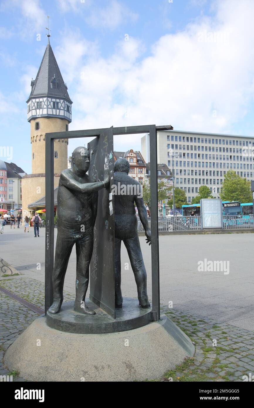 Sculpture Man in revolving door by Waldemar Otto 1986 at the Bockenheimer Warte with waiting tower, figures, two, tower, revolving door, door, turn Stock Photo