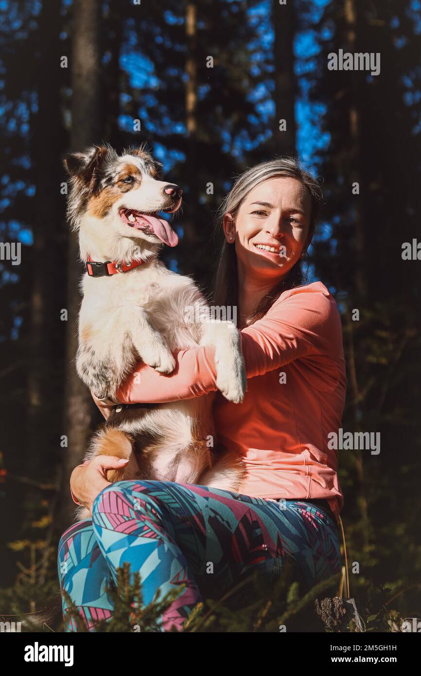 Candid portrait of a young female athlete with her running and hiking