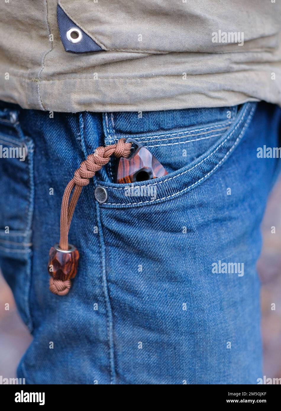 Knife in pocket outdoor. Stock Photo