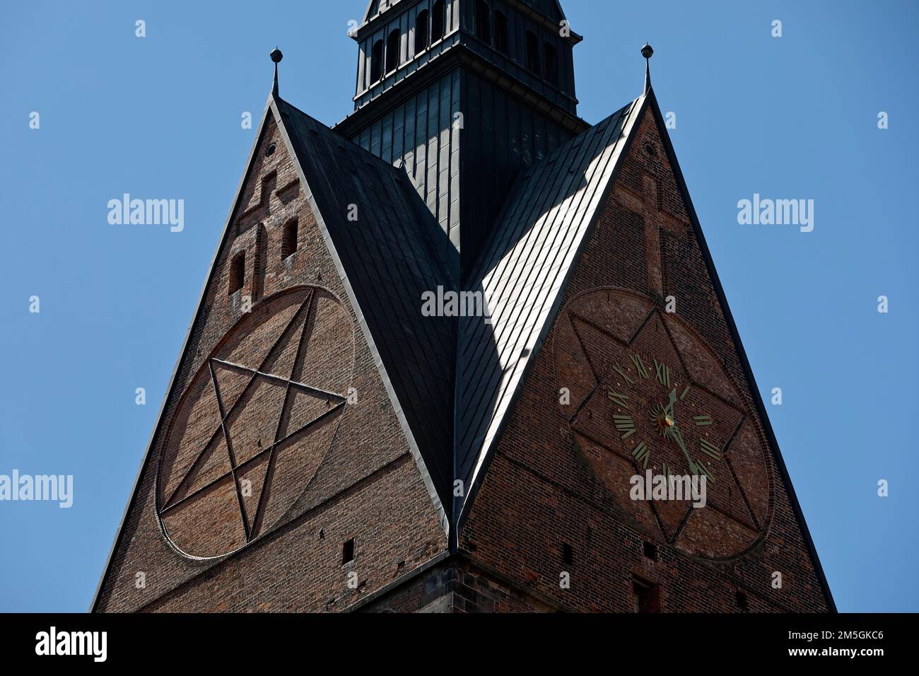 Tower detail of the Marktkirche St. Georgii et Jacobi with hexagram and tower clock, state capital Hannover, Lower Saxony, Germany Stock Photo
