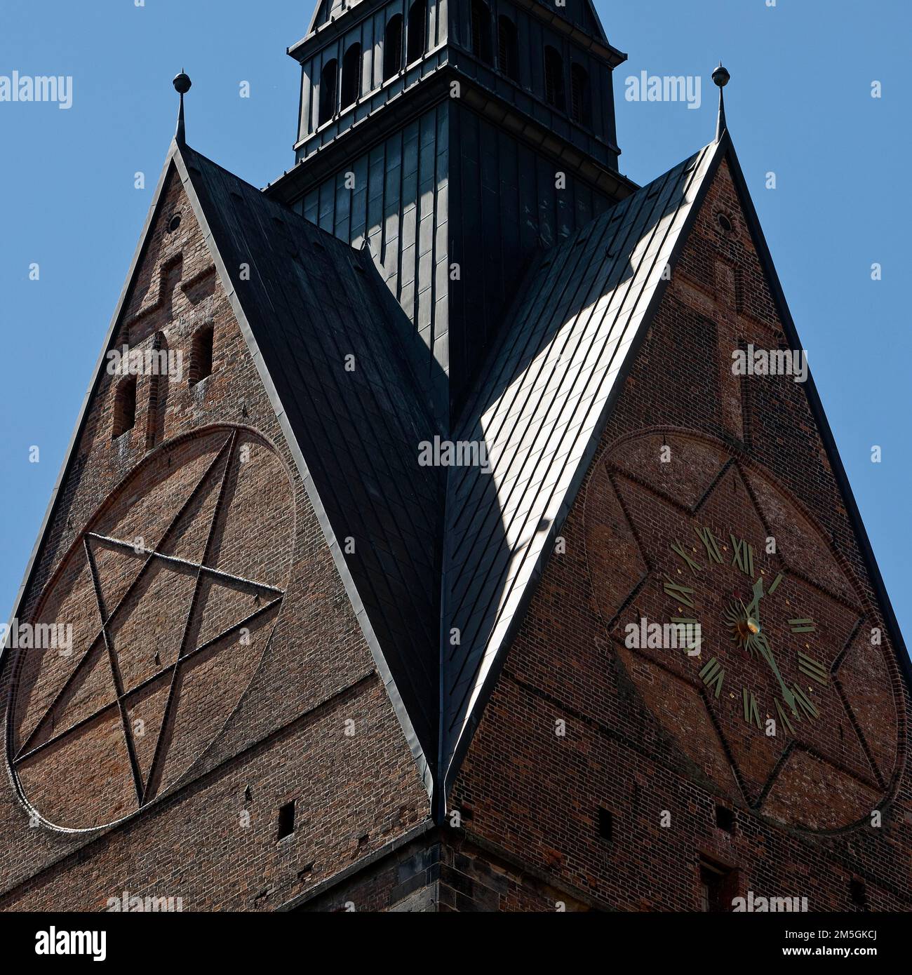 Tower detail of the Marktkirche St. Georgii et Jacobi with hexagram and tower clock, state capital Hannover, Lower Saxony, Germany Stock Photo