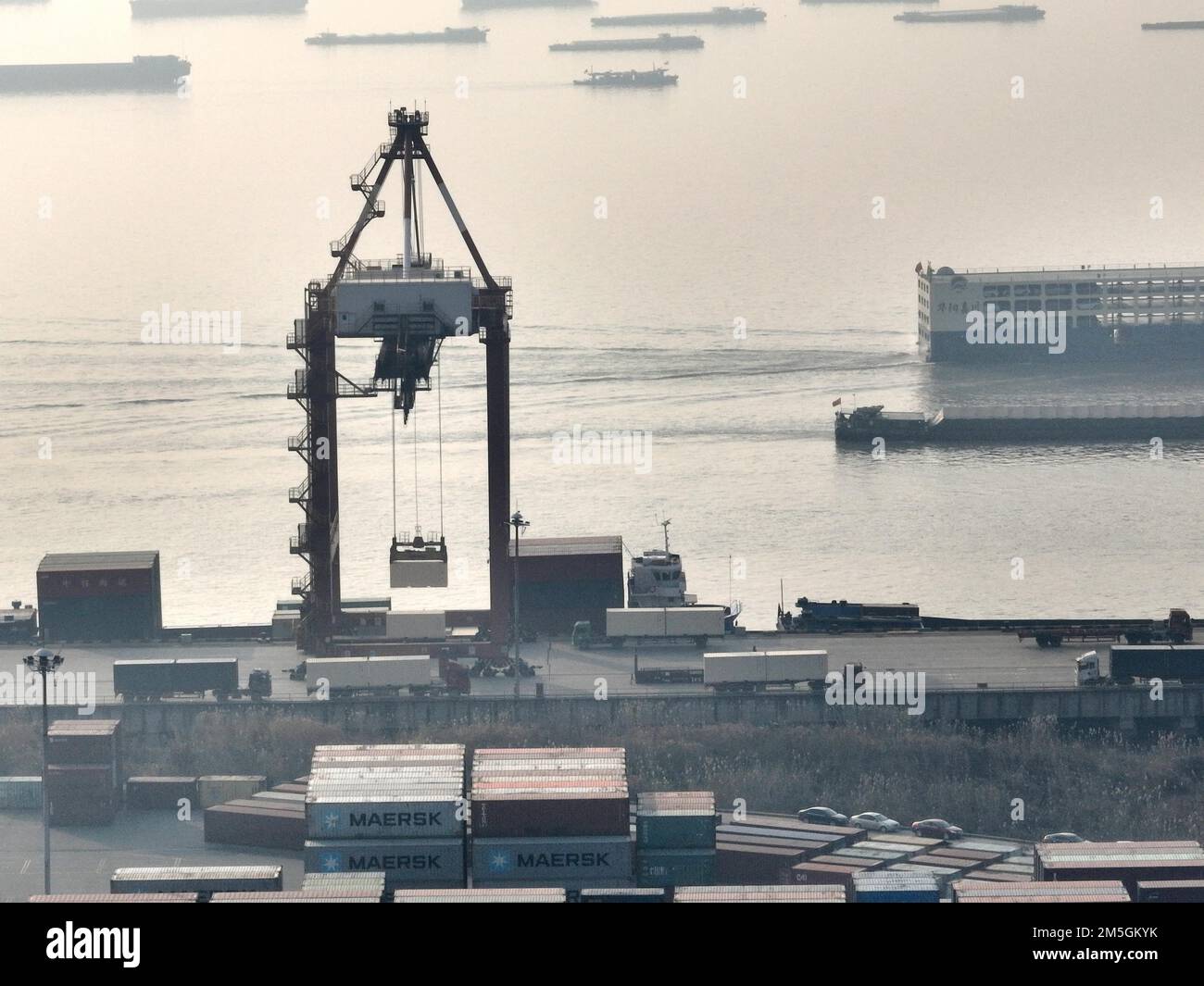 Aerial photo shows cargo ships loading and unloading containers at the ... image.