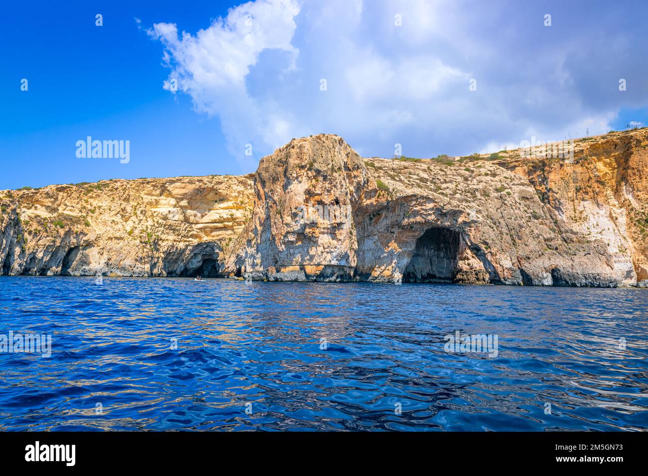 Blue Grotto in Malta.  The sea cave is located near Wied iż-Żurrieq south of Żurrieq in the southwest of the island of Malta. Stock Photo