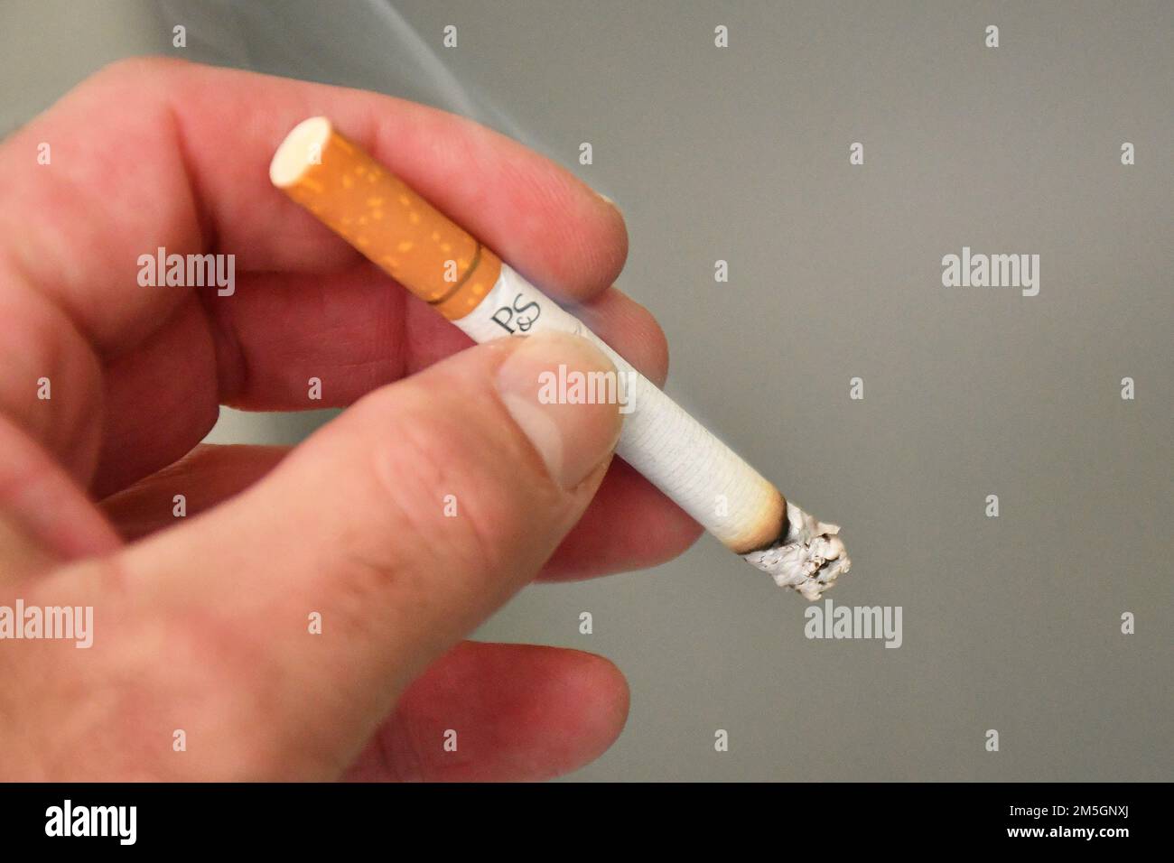 cigarette, cigarettes, ashtray, ash, fag end, butt, butts, hand, finger,  smoker, smoking, smokers. (CTK Photo/Petr Svancara Stock Photo