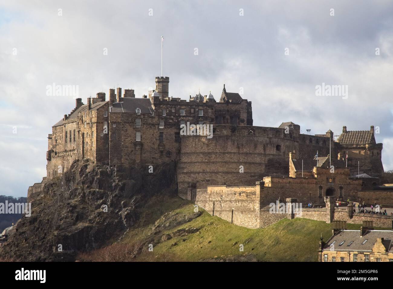 The exterior of the early medieval Edinburgh Castle and tourists
