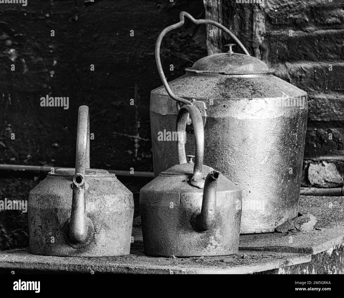 Two old teapots and a kettle in a vintage canteen Stock Photo Alamy