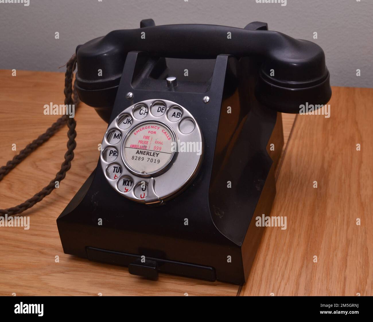 Old vintage, black, rotary dial phone or telephone, used in the past to