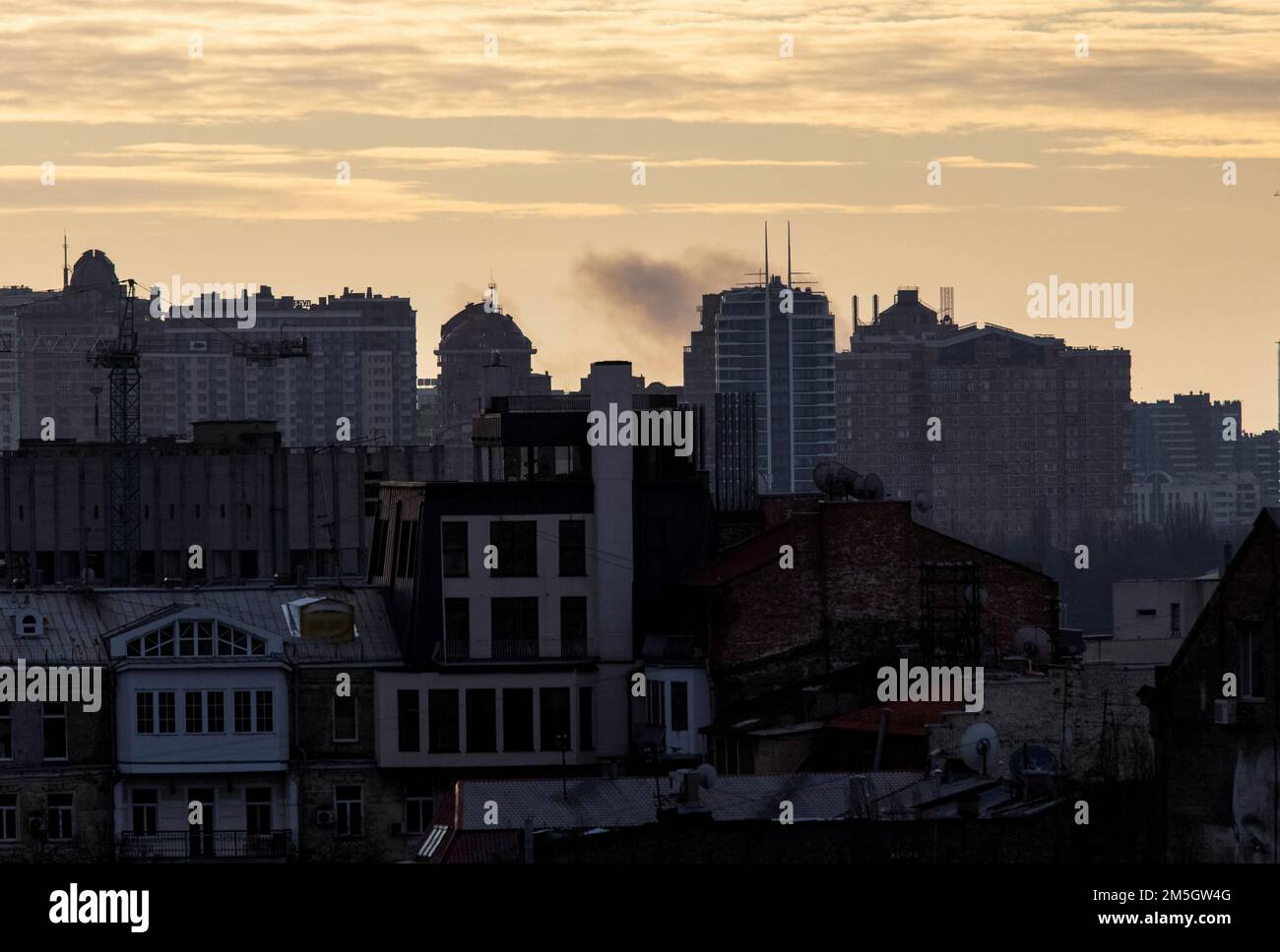 Smoke rises after a missile strike, as Russia's attack on Ukraine continues, in Kyiv, Ukraine December 29, 2022. REUTERS/Anna Voitenko Stock Photo