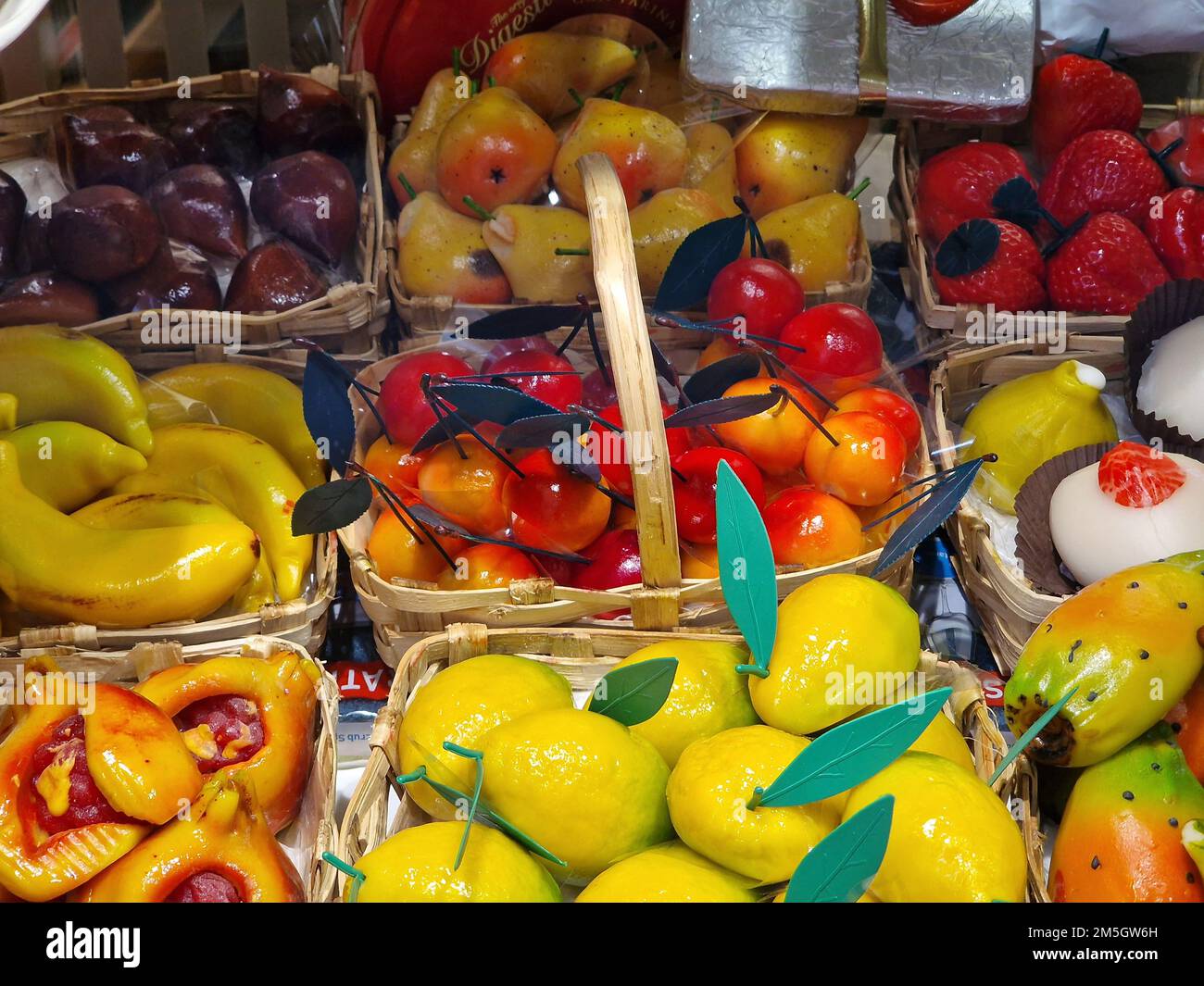 fresh glazed fruit sweet on display in pastry shop detail Stock Photo
