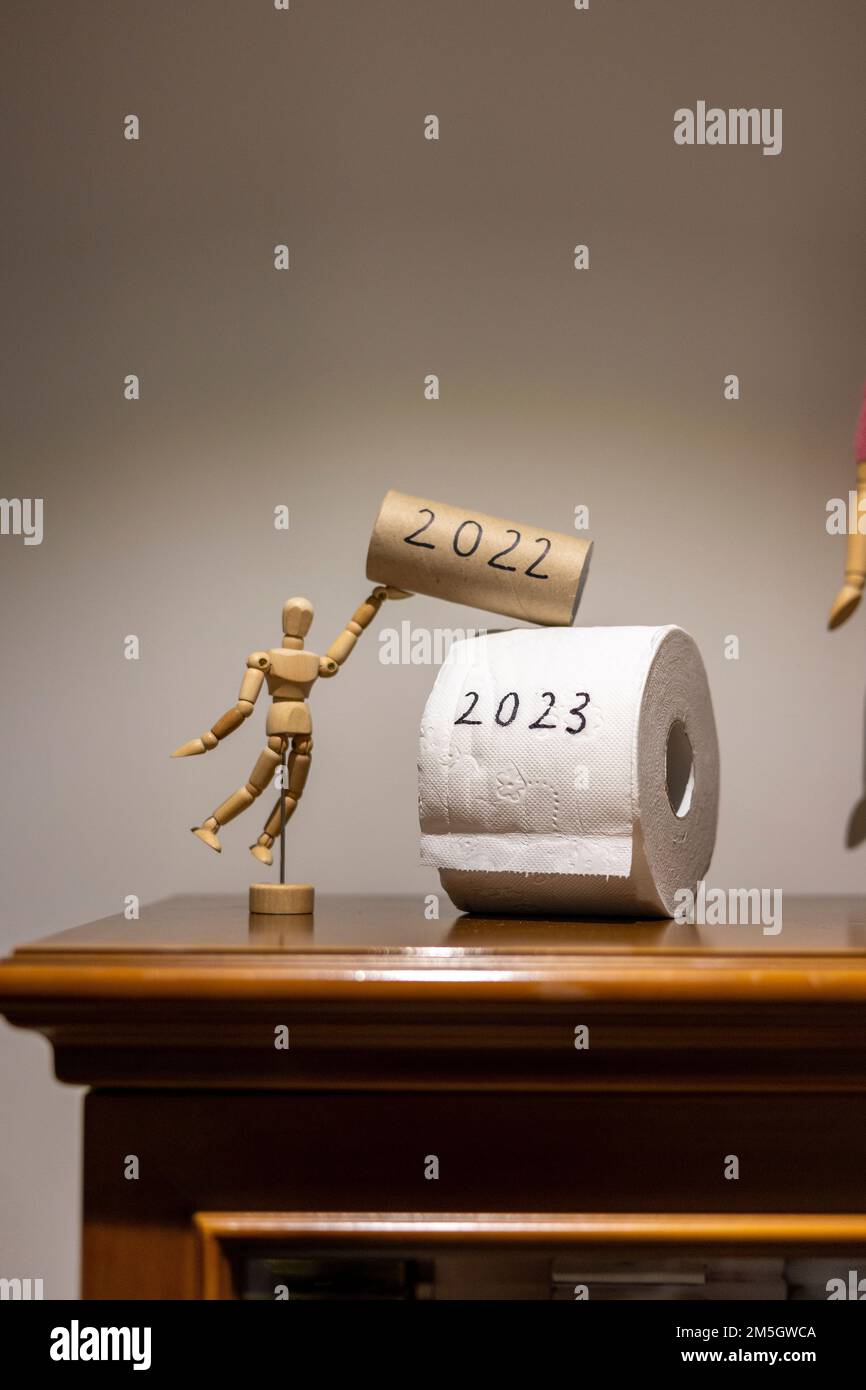 Toilet papers written as 2022 and 2023 which means see the old year go and welcome the new year in Stock Photo