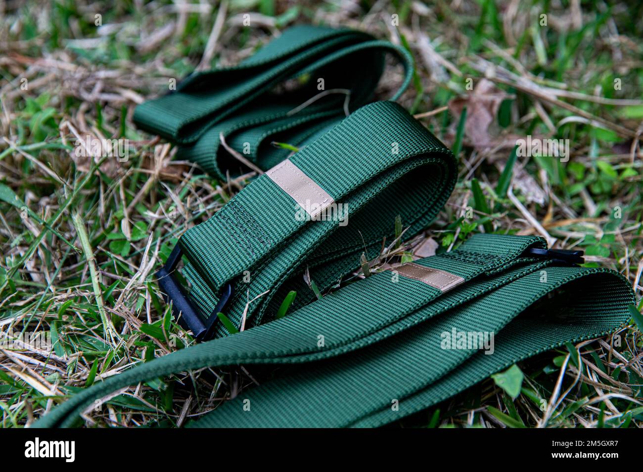 Green belts marked with a tan tab to signify that a marine is a marine