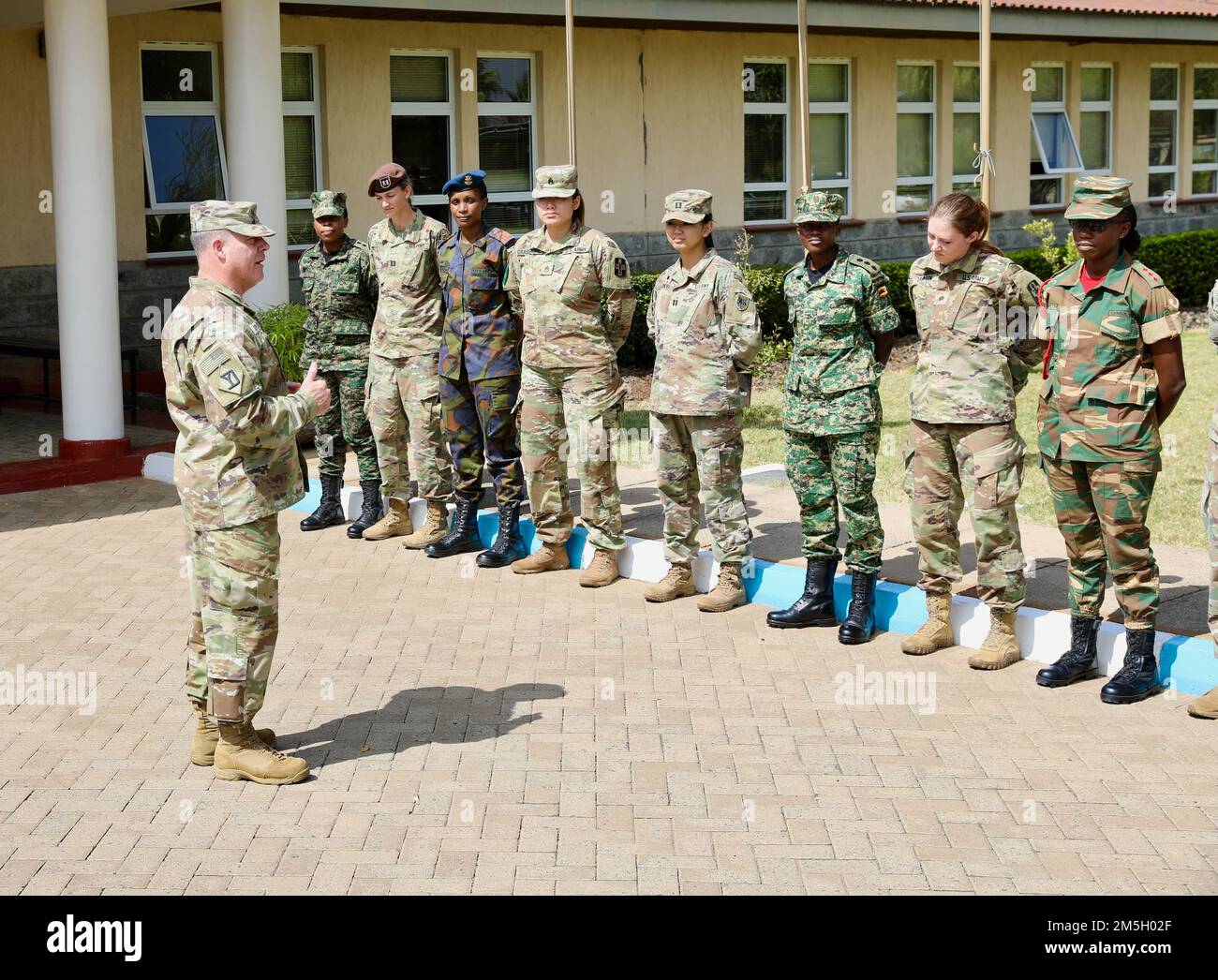 Brig. Gen. Ronald A. Cupples, the U.S. Army Southern European Task Force, Africa deputy commanding general and the National Guard Joint Force Headquarters-Massachusetts assistant adjutant general addresses women participants in Exercise Justified Accord during Women’s History Month, March 18, 2022, Nairobi, Kenya. Exercise Justified Accord allows the US and our African partners to support enduring peace and stability in the region. Over 800 personnel participated in the exercise which includes a multinational field training exercise and a command post exercise. Stock Photo