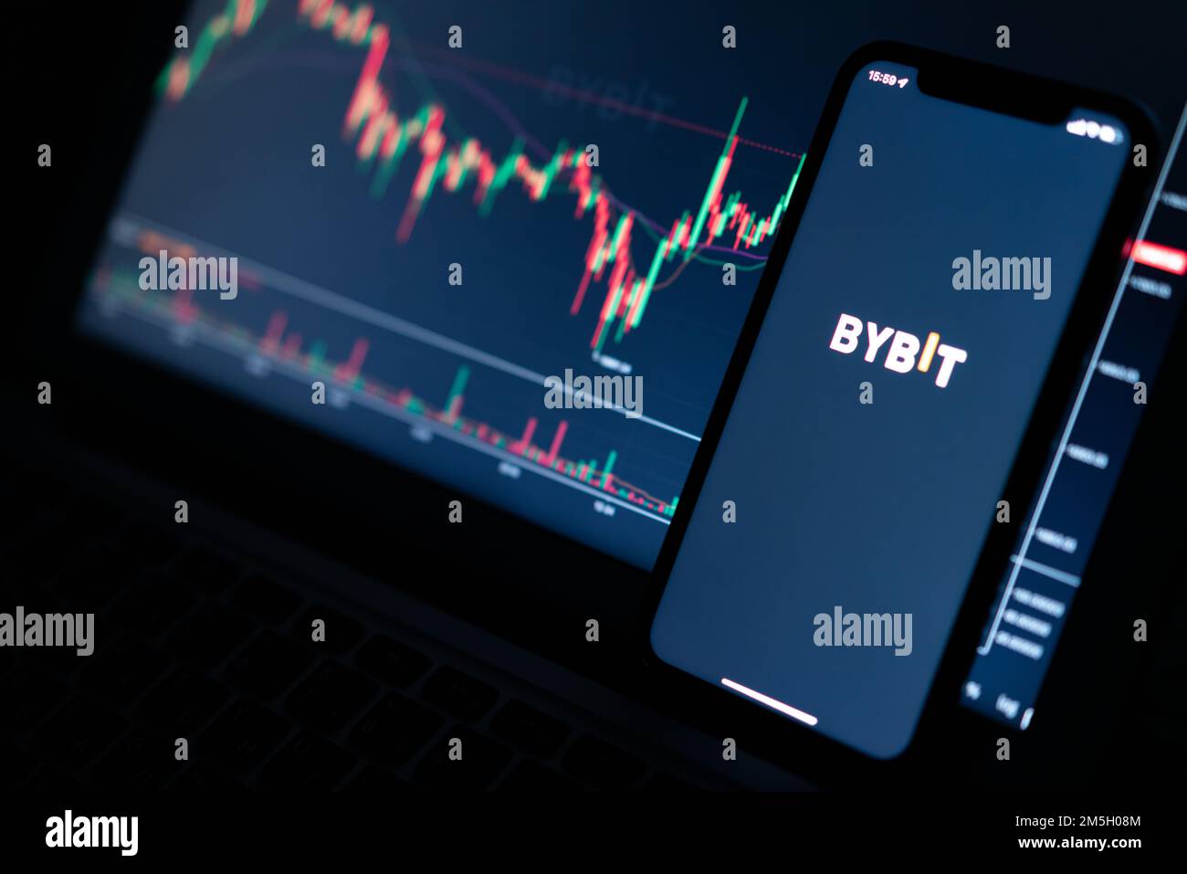 Bybit mobile app crypto exchange on mobile phone screen against blurred  cryptocurrency chart Stock Photo - Alamy