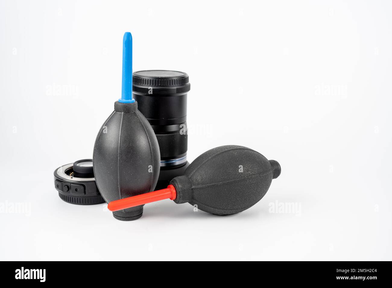 pair of air rocket type blowers and camera lenses on a white background
