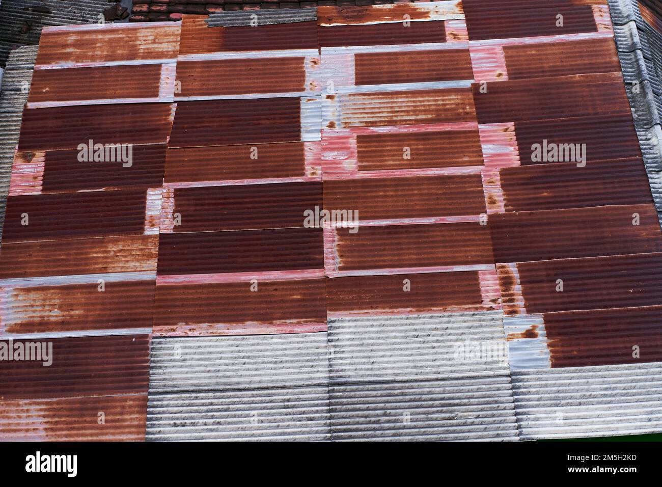 Roofs of private houses made of slate and shingles. Stock Photo