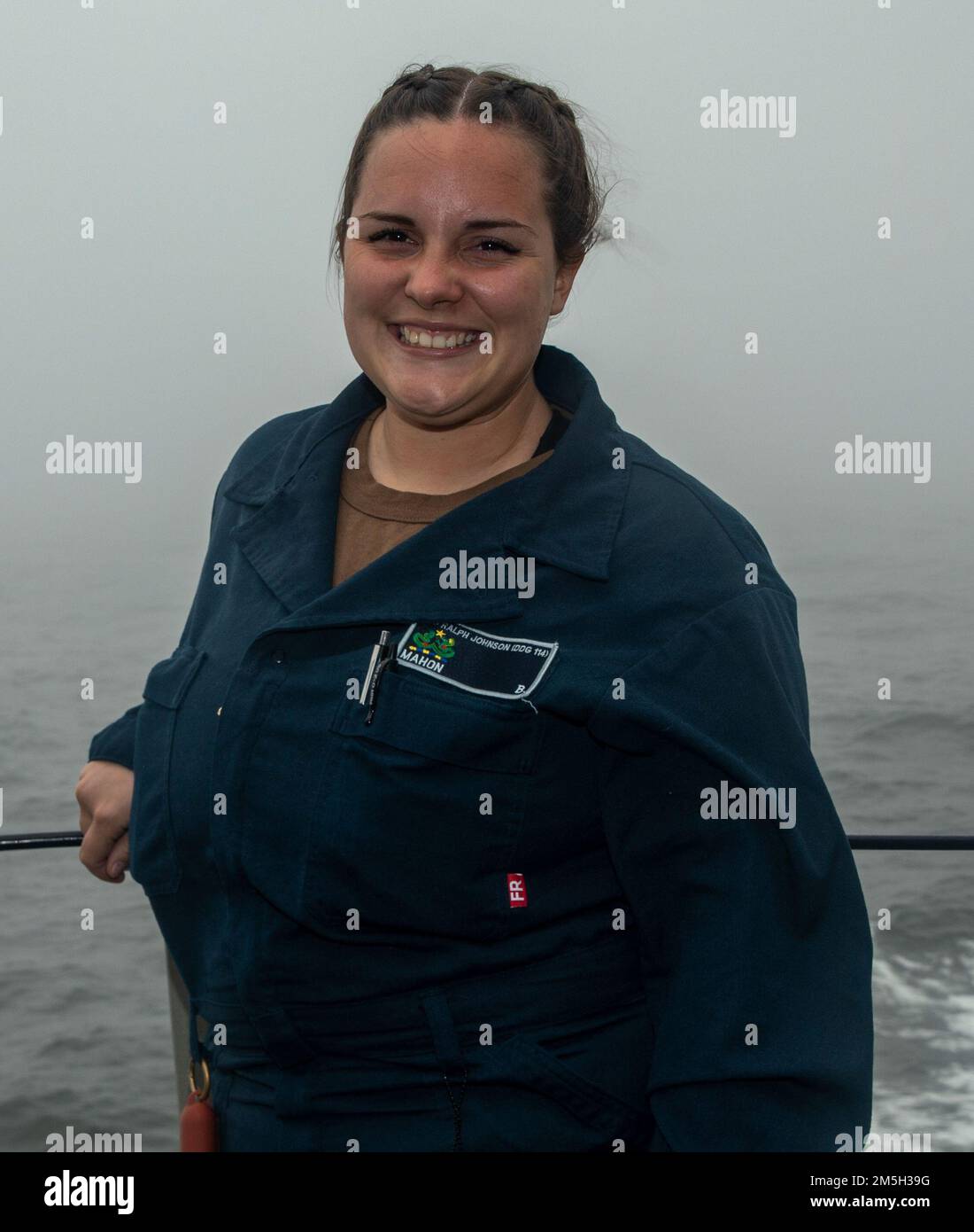 EAST CHINA SEA (March 17, 2022) Logistics Specialist Seaman Bayilee Mahon, from San Diego poses for a photo aboard USS Ralph Johnson (DDG 114). USS Ralph Johnson is assigned to Task Force 71/DESRON 15, the Navy’s largest forward-deployed DESRON and the U.S. 7th fleet’s principal surface force. Stock Photo